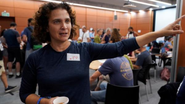 Professor Karine Nahon, head of the missing civilians war room, gestures as she describes the initiative by cyber professio<em></em>nals which uses cutting-edge technology to identify and locate missing people and hostages, following a deadly infiltration by Hamas gunmen from the Gaza Strip, in Tel Aviv, Israel October 16, 2023. REUTERS/Janis Laizans