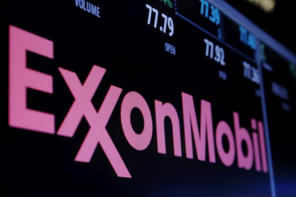 The Exxon logo is displayed above the floor of the New York Stock Exchange (NYSE) shortly after the opening bell in New York