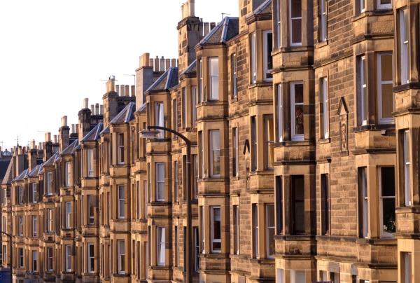 A row of Victorian sandstone flats in residential use in the UK.