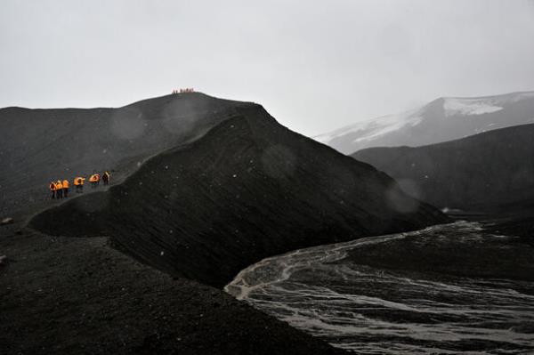 Trekking up a black volcano in Antarctica