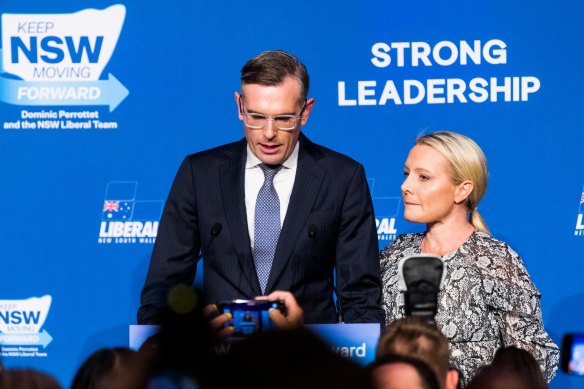 Premier Dominic Perrottet, with wife Helen, co<em></em>ncedes defeat at the Liberal Party’s election event at the Hilton Hotel in Sydney.