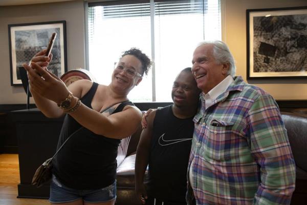 Henry Winkler poses for a photo with a few fans at Loews Chicago O'Hare Hotel on Saturday, August 13, 2023, in Rosemont, Illinois. (John Konstantaras/For the Chicago Tribune)