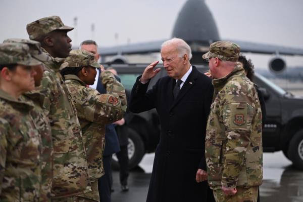 US President Joe Biden greets military perso<em></em>nnel on arrival at Dover Air Force ba<em></em>se in Dover, Delaware, on February 2, 2024, to attend the dignified transfer of the remains of three US service members killed in the drone attack on the US military outpost in Jordan.