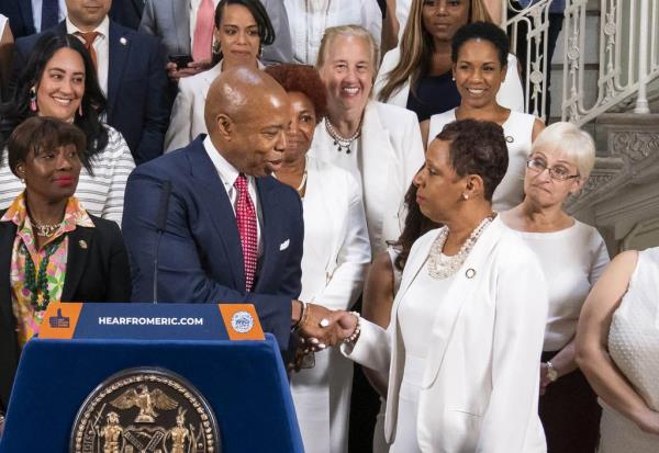 Mayor Eric Adams and New York City Council Speaker Adrienne Adams shake hands while announcing an agreement for a budget for Fiscal Year 2024 at City Hall on Thursday, June 29, 2023. 