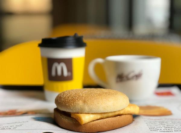 mcdo<em></em>nalds breakfast sandwich and coffee