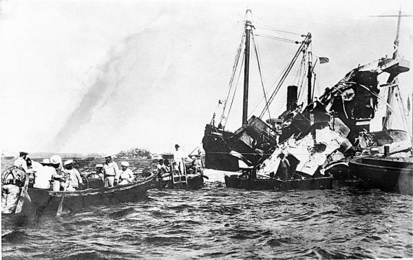 Lifeboats rescue surviving crewmen of the wrecked USS Maine after an underground explosion destroyed the battleship on the night of Feb. 15 as it was anchored in the Havana harbor, Cuba, in 1898.