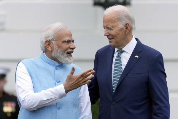 India's Prime Minister Narendra Modi speaks with President Joe Biden during a State Arrival Ceremony on the South Lawn of the White House Thursday, June 22, 2023, in Washington.