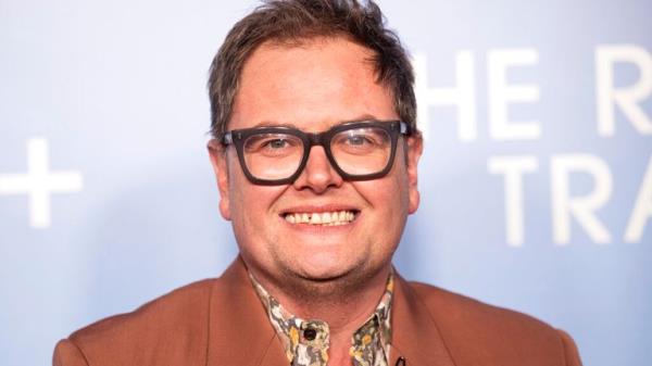 Alan Carr poses for photographers upon arrival for the premiere of the film 'The Reluctant Traveller' in London, Tuesday, Feb. 14, 2023. (Photo by Vianney Le Caer/Invision/AP)