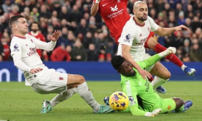 Sofyan Amrabat and the goalkeeper André o<em></em>nana collide during Manchester United’s draw at Anfield.