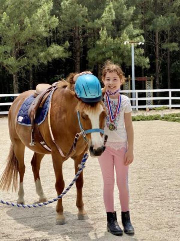 Student at helping horse