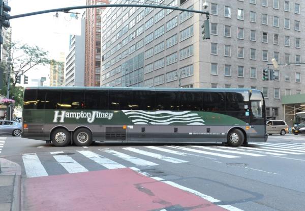 A Hampton Jitney bus on a street in New York City.