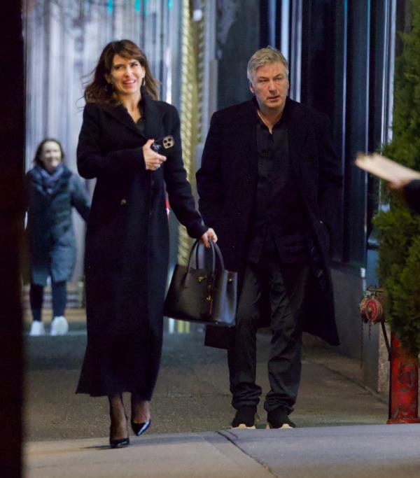 Alec and Hilaria Baldwin holding hands. 