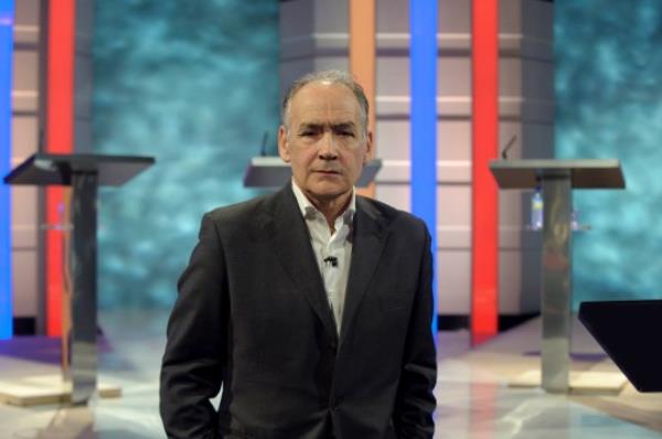 British journalist and newscaster Alastair Stewart looks on as the stage is prepared for the first televised general election debate between Gordon Brown, David Cameron and Nick Clegg for the United Kingdom's Prime Minister at ITV1 North West ba<em></em>se studios on April 14, 2010 in Manchester, England