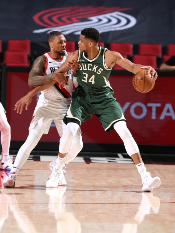 Damian Lillard #0 of the Portland Trail Blazers plays defense on Giannis Antetokounmpo #34 of the Milwaukee Bucks.