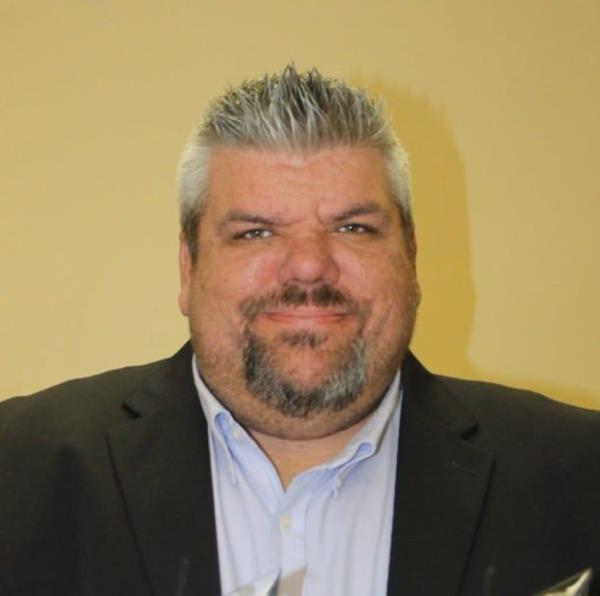 Radio station general manager Brett Elmore is pictured.