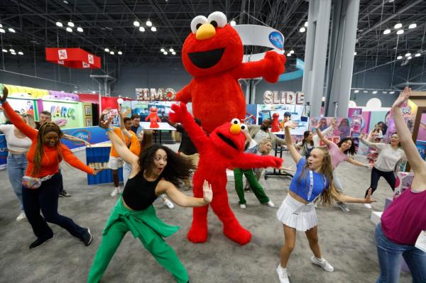 A person wearing an Elmo Slide costume.