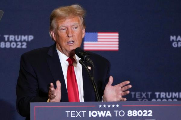 Former President Do<em></em>nald Trump speaks during a commit to caucus rally, Dec. 13, 2023, in Coralville, Iowa. Trump's lawyers are pressing to have special counsel Jack Smith's team held in contempt. The Republican former president's lawyers said Thursday, Jan. 4, 2024, prosecutors have taken steps to advance the 2020 election interference case against him in violation of a judge's order that put the case on hold.