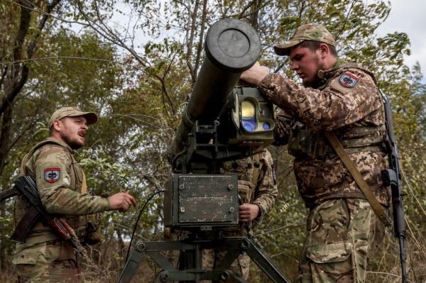 Ukrainian servicemen from the 128th Mountain Assault Brigade install a man-portable 'Skif' anti-tank guided missile (ATGM) system at an undisclosed location in the Zaporizhia region, southeastern Ukraine