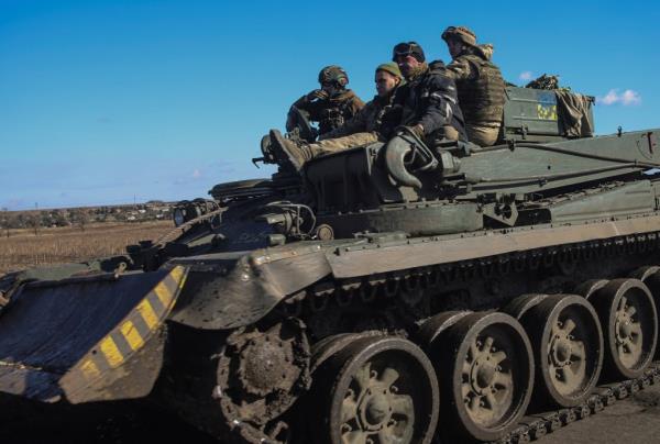 Ukrainian servicemen ride along a road atop of an armoured engineer vehicle, amid Russia's attack on Ukraine, in Do<em></em>netsk region, Ukraine October 18, 2023