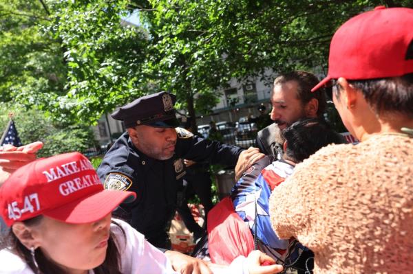 The scuffle broke out when an anti-Trump protesters started an anti-Israel chant.