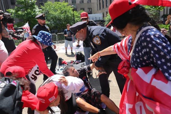 NYPD officers rushed into to separate the men.