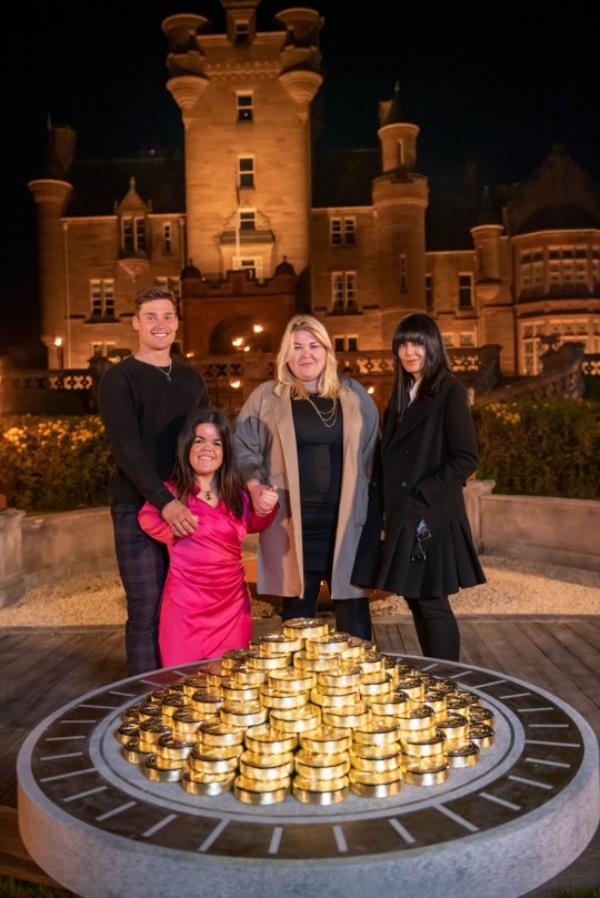 The Traitors winners Aaron, Meryl and Hannah with host Claudia Winkleman. 