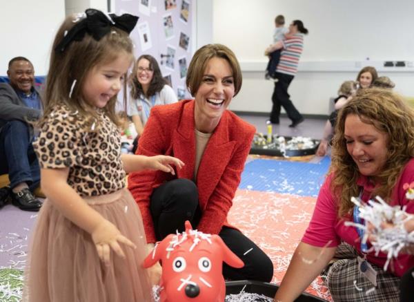 Duchess of Cambridge, Catherine, smiling while using a laptop for a video co<em></em>nference call with baby banks during her visit to Baby Basics in Sheffield, England