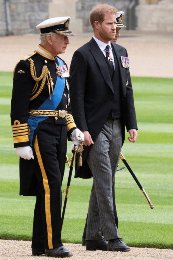 King Charles III and Prince Harry, Duke of Sussex arrive at St George's Chapel, Windsor Castle for the Committal Service for Queen Elizabeth II.