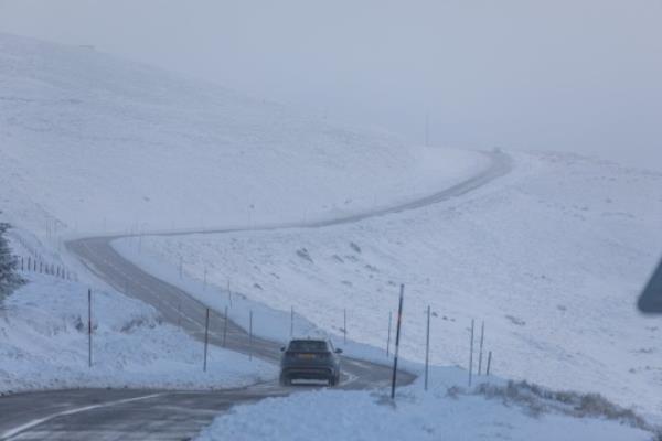 A car makes it way along the A939 after heavy snowfall in the Cairngorms