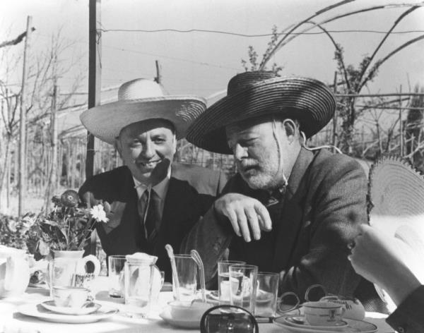 Giuseppe Cipriani and Ernest Hemingway photographed in Venice, wearing sombreros.