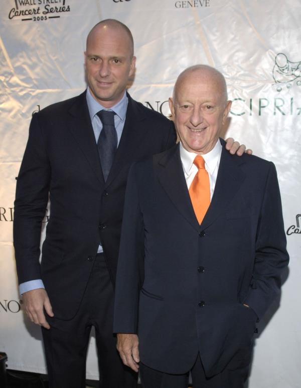 Giuseppe Cipriani Jr. and his father Arrigo Cipriani pose on a red carpet at Cipriani.