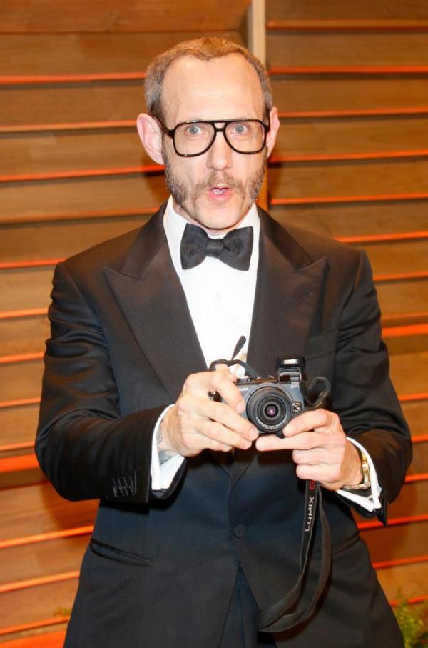 Terry Richardson taking a photograph with a Canon digital camera