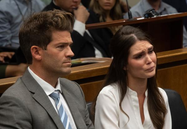 LAGUNA BEACH, CA - OCTOBER 17: Dr. Grant Robicheaux and his girlfriend Cerissa Riley listen during their arraignment at the Harbor Justice Center in Newport Beach, CA on Wednesday, October 17, 2018