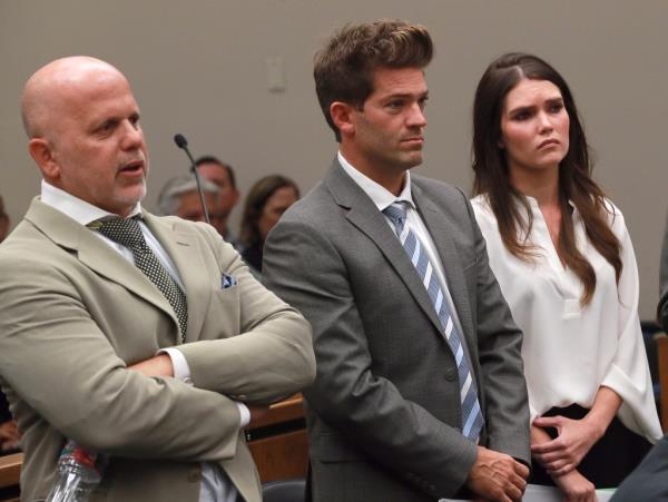 NEWPORT BEACH, CA - OCTOBER 17:  Dr. Grant Robicheaux, center, with girlfriend Cerissa Riley, plead not guilty to a slew of felony charges during a court appearance with their attorney Phillip Cohen on Wednesday, October 17, 2018 in Newport, California. Prosecutors added felony kidnapping counts and increased bail for the celebrity doctor to $1 million