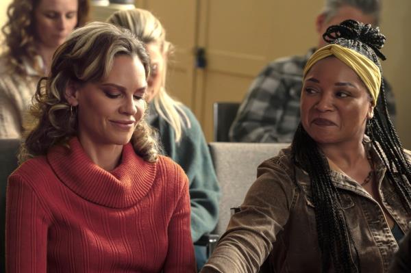 Actors Hilary Swank and Tamala Jo<em></em>nes sit side-by-side in a still from the film 