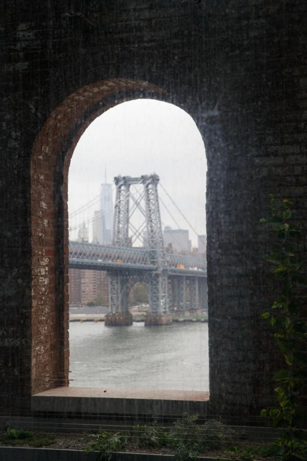 Arched window at the Refinery at Domino with view of bridge. 