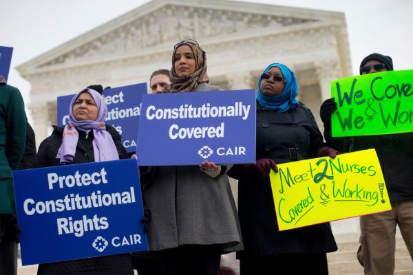 Chaudry (C) is seen with other demo<em></em>nstrators outside the Supreme Court in Washington on Feb. 25, 2015.