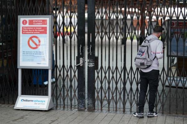 A passenger looks through the closed Moor Street Station in Birmingham, wher<em></em>e members of the drivers' unio<em></em>n Aslef are on the picket line. Rail passengers will suffer fresh travel disruption in the next few days because of more strikes in long-running disputes over pay, jobs and conditions. Picture date: Wednesday May 31, 2023. PA Photo. See PA story INDUSTRY Strikes. Photo credit should read: Jacob King/PA Wire