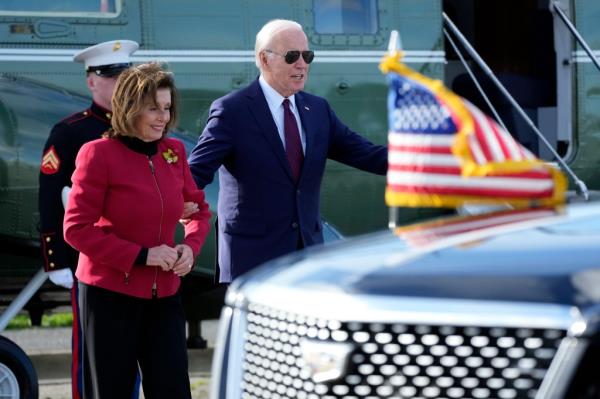 President Joe Biden escorts Rep. Nancy Pelosi, D-Calif., from Marine One to attend a fundraiser in San Francisco, Wednesday, Feb. 21, 2024