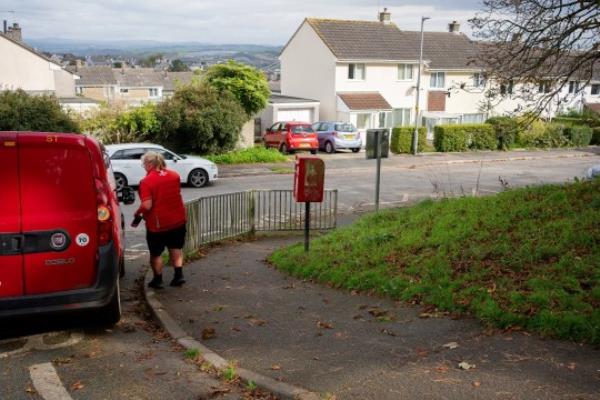 The postbox on Lynher Drive, Saltash captured on the 16th October 2023 after calls to Royal Mail have been made to move the postbox on the steep slope after a man falls while using it. See SWNS story SWLNbox. Town calls for for Royal Mail to move a postbox because it's on a 'dangerous' slope. Residents of Lynher Drive in Saltash, Cornwall, say the location is hazardous to elderly locals - after an 86-year-old man slipped and fell while using the box during heavy rainfall. Photos of the box show how it is positio<em></em>ned next to a roadside path with a steep hill bank - creating potentially hazardous co<em></em>nditions in winter. In a post on a local Facebook group, locals agreed that the box should be relocated.