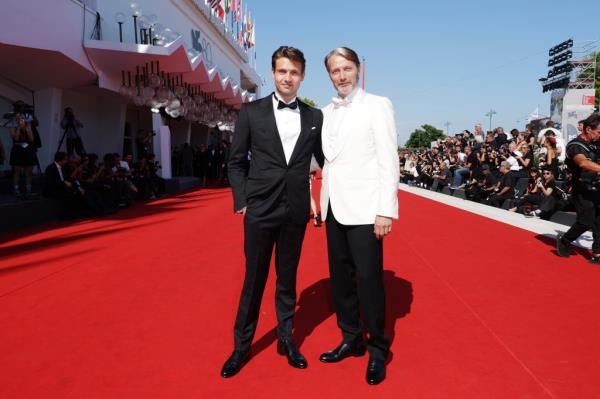 Mads Mikkelsen (R) with his son Carl Jacobsen Mikkelsen arrive on the red carpet ahead of the 