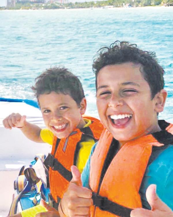 Jacob and Mark Iskander on a boat. 