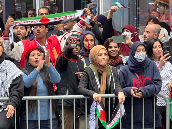 A person displaying a swastika during a pro-Palestinian rally in Manhattan on October 8, 2023.