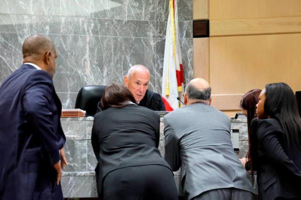 Judge John Murphy speaks with attorneys during a sidebar discussion during closing arguments in the trial of Jamell Demons, better known as rapper YNW Melly, at the Broward County Courthouse in Fort Lauderdale on Thursday, July 20, 2023. Demons, 22, is accused of killing two fellow rappers and co<em></em>nspiring to make it look like a drive-by shooting in October 2018. (Amy Beth Bennett / South Florida Sun Sentinel)