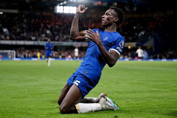 Nicolas Jackson of Chelsea celebrates after scoring the team's third goal during the Premier League match between Chelsea FC and Luton Town