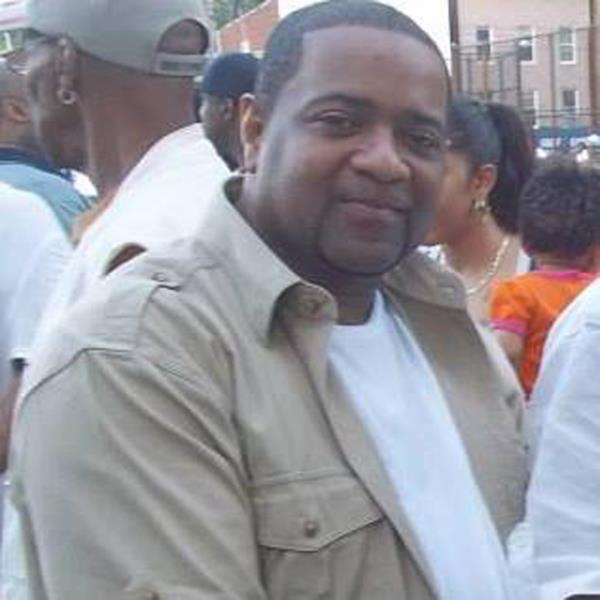 Kenneth Foster smiles among crowd in Facebook post.