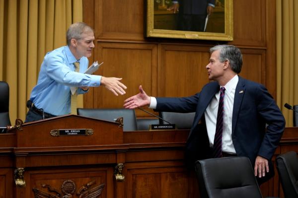 Rep. Jim Jordan, R-Ohio, left, chair of the House Committee on the Judiciary, speaks with FBI Director Christopher Wray after Wray testified at an oversight hearing, Wednesday, July 12, 2023, on Capitol Hill in Washington.