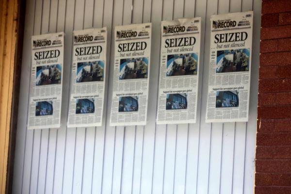 Front pages for the Marion County Record’s latest weekly edition are displayed on a window at its offices