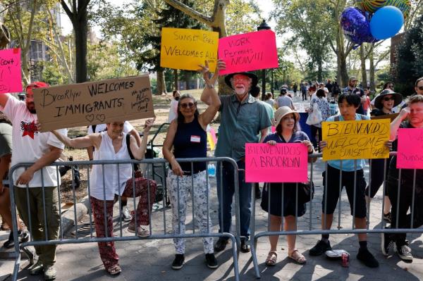 Volunteer groups welcome migrants to Sunset Park Recreation Center with food and other support on August 6, 2023.