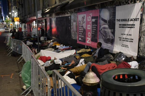 Migrants sleeping in front of the Roosevelt Hotel.